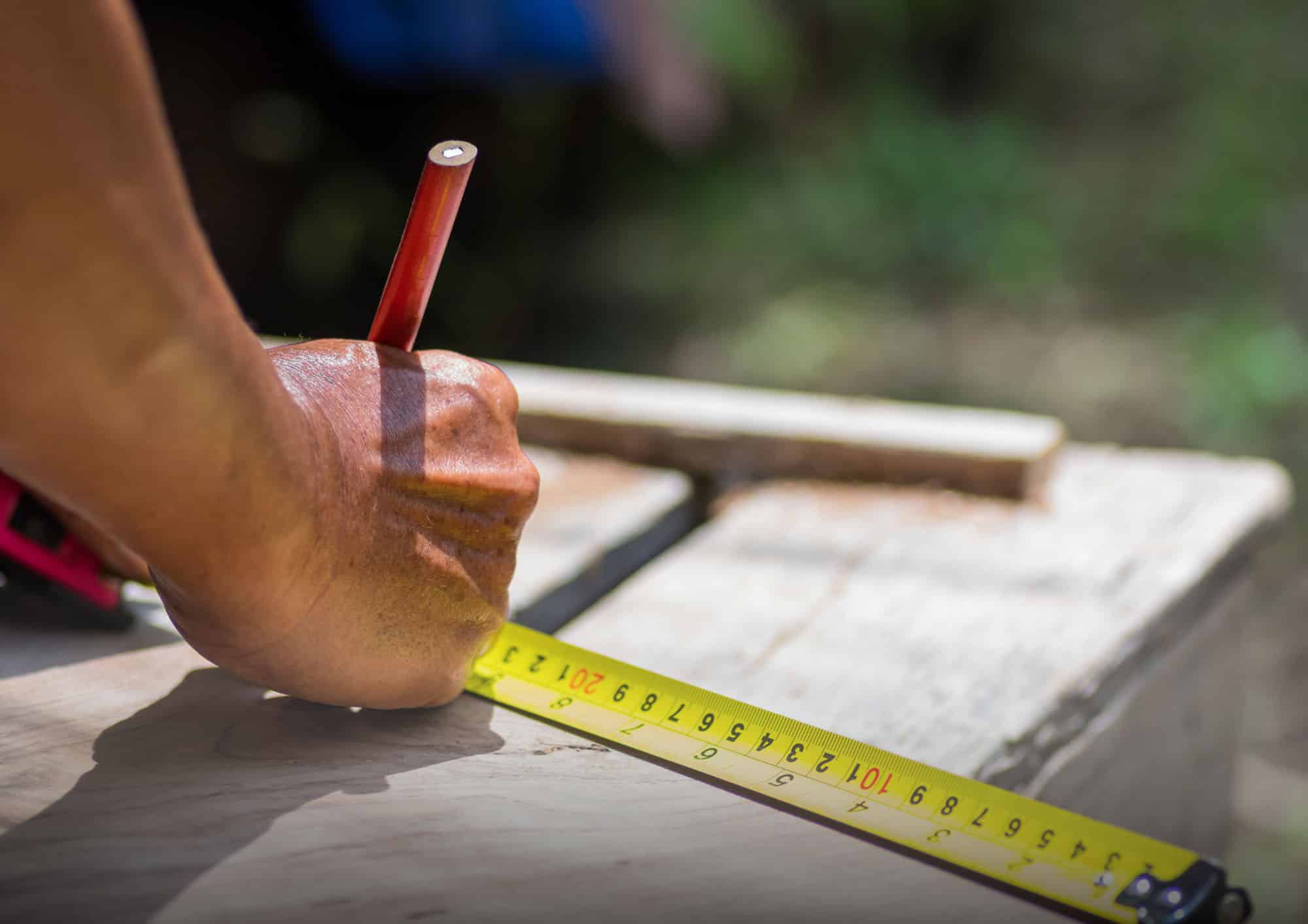 Builder Measuring a Block of Land 2048x1448 - 1